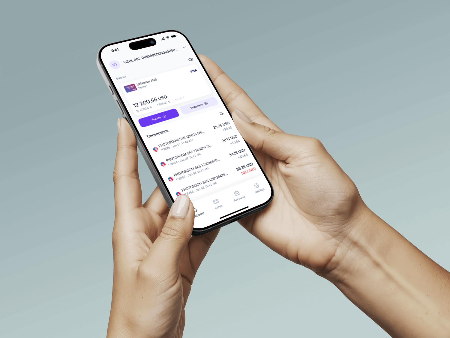 Hand holding a phone with the Elibrium mobile app